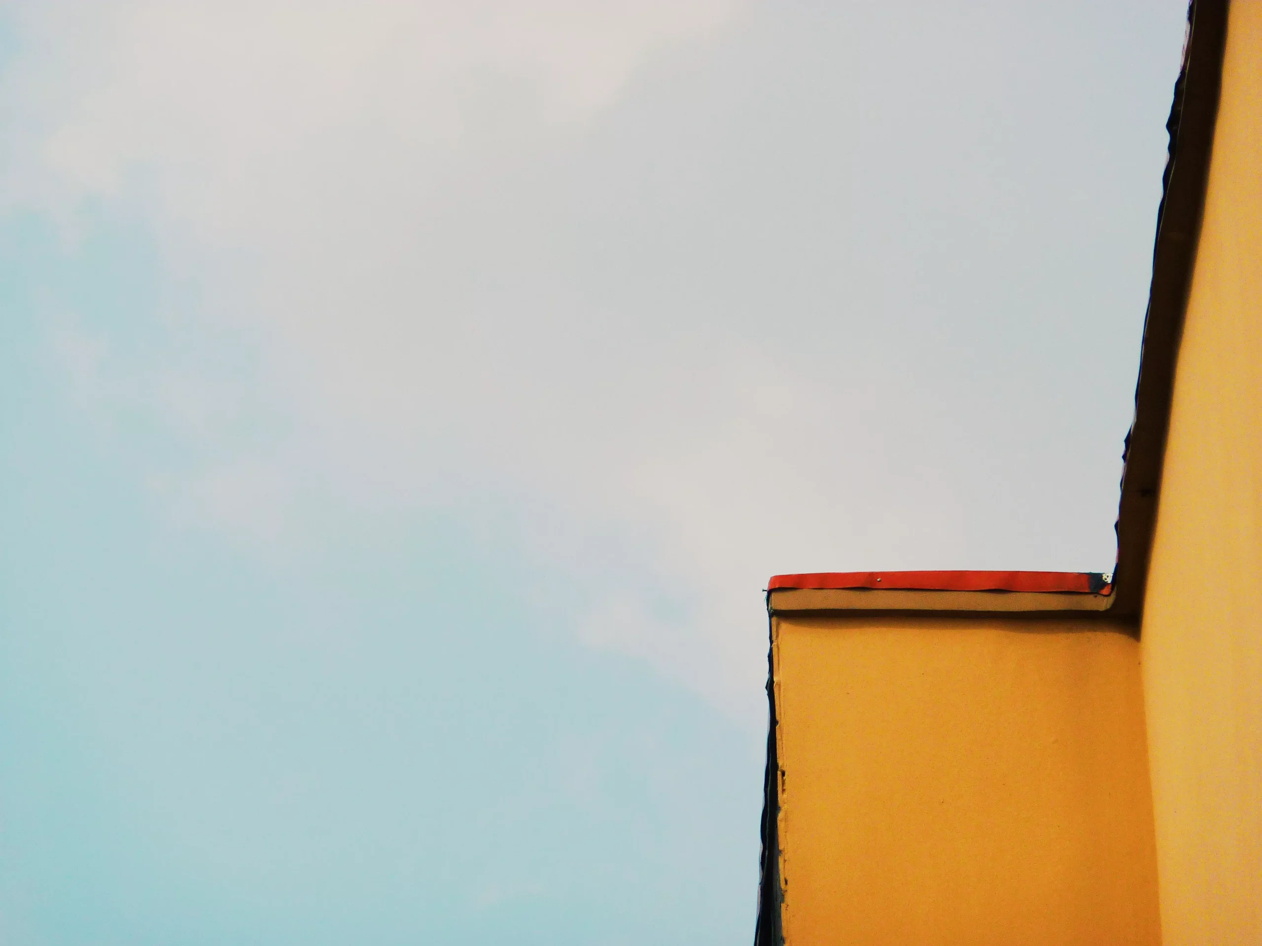 yellow building against the sky